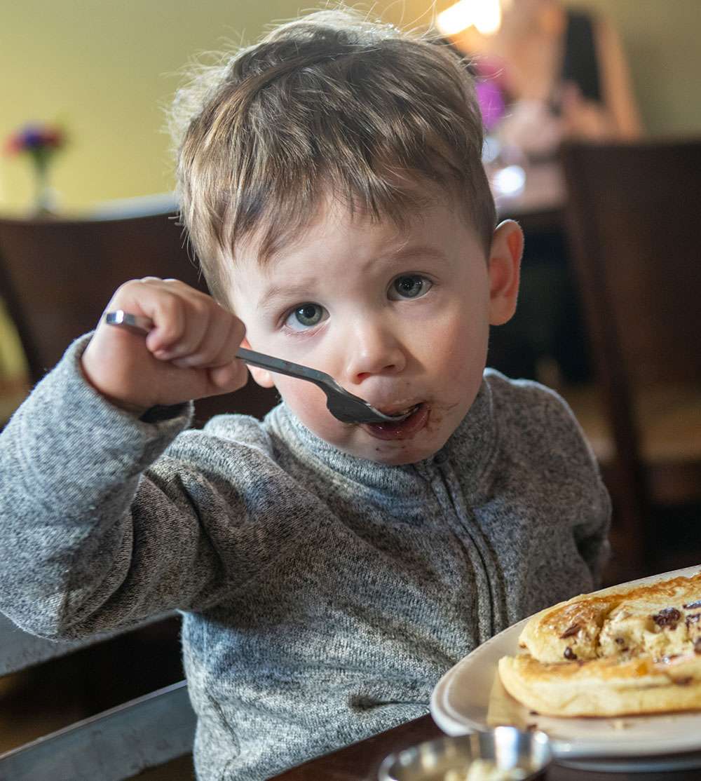 Little Boy enjoying food at The Mill in Hershey